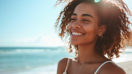 Smiling woman with curly hair enjoying the beach.