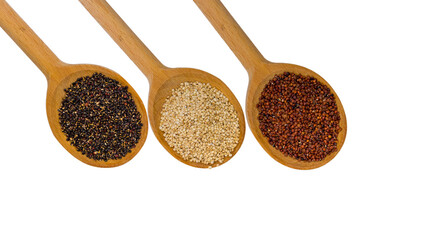 Red white and black quinoa in a wooden spoon. Isolated on white.