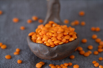 Uncooked lentils on black background