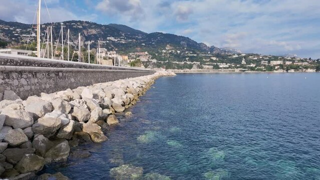 Drone rises on the sea wall of the royal port of La Darse in Villefranche-sur-mer. France