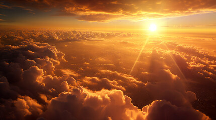 Aerial view of dramatic vibrant orange and yellow sunset or sunrise with clouds, and light rays....