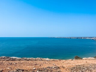 rocky coast of the ocean, rocks at the ocean beach, ocean horizon