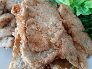 Homemade grilled chicken with grilled zucchini, green salad, spring rolls, rice pilaf and parsley. Broccoli seeds on top of the rice pilaf.