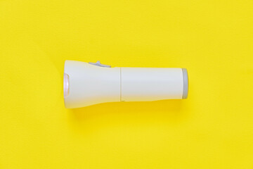 Flashlight on Yellow Background