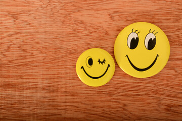 A cheerful yellow smiley face symbolizing positive thinking, concealing underlying negative emotions with a steadfast grin.