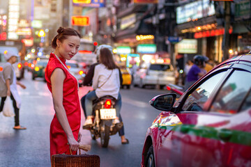 Chinese woman wearing traditional clothing walks around Yaowarat, Bangkok, Thailand, Chinese New...