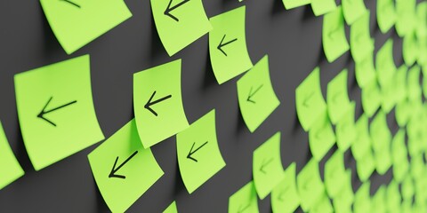 Many green stickers on black board background with arrow pointing left symbol drawn on them. Closeup view with narrow depth of field and selective focus. 3d render, Illustration