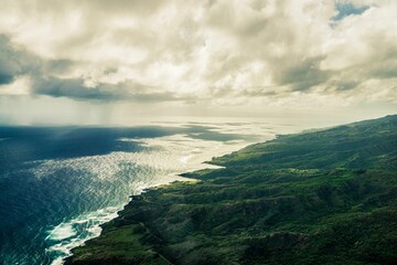 View of the stunning coastline with lush green vegetation and crystal blue waters