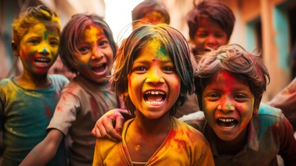 Group of kids having fun at Holi color festival in India. Party of young people having fun at Holi colors celebration in Asia. Holi color festival concept. Laughing children covered in colorful powder