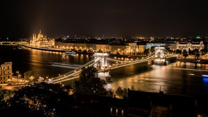 the chain bridge and river in budapest by night, seen from the top