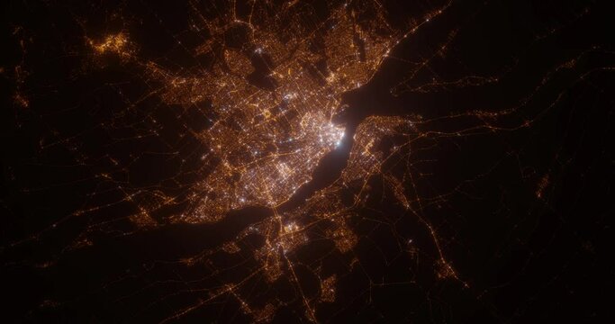 Quebec (Canada) aerial view at night. Satellite view on modern city with street lights. Camera is flying above the city, moving forward