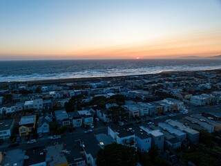 Aerial view of a neighborhood illuminated by the setting sun. San Francisco, California.