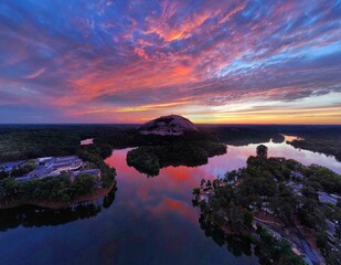 Beautiful sunset over a peaceful lake and Stone Mountain in Georgia.