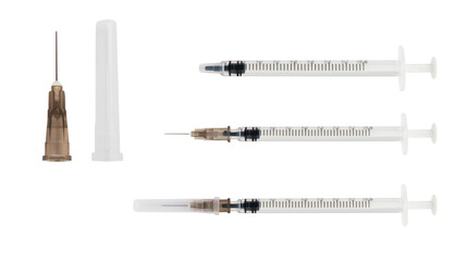 Set of insulin syringes, needle, cap on a blank background.