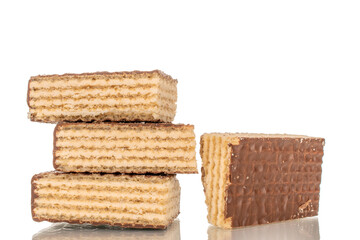 Several sweet chocolate wafers, macro, isolated on white background.