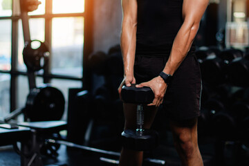 Exercise with dumbbells Lift weights to build strong arm muscles, an activity for good physical health.