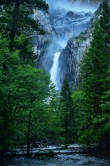 Picturesque landscape featuring a flowing waterfall in Yosemite National Park