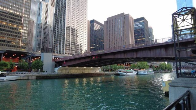 Beautiful view of the Bridge Chicago river with boats and city towers in the background in Chicago