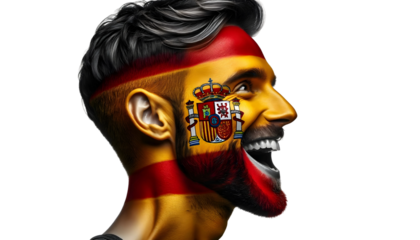 man soccer fun profile portrait with painted face of spanish national flag isolated on transparent background