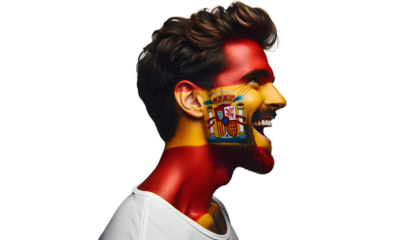 man soccer fun profile portrait with painted face of spanish national flag isolated on transparent background