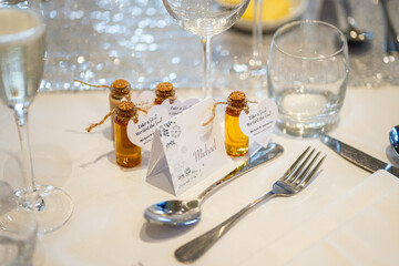 Elegant Wedding Reception Table Setting with Personalized Favors and Name Cards
