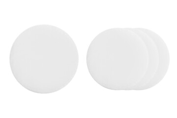 Cotton round cosmetic sponges on a blank background