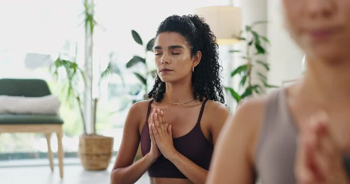 Woman, yoga and meditation in class for holistic wellness, zen and healing in breathing exercise. People or friends with namaste, peace and prayer hands for mindfulness, mental health and calm
