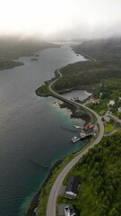 Stunning aerial view of the Lofoten Islands in Norway with rolling hills and vibrant buildings