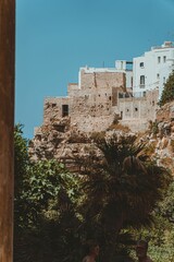 Obraz premium Scenic view of antique houses against the sea in Bari, Italy on a sunny day