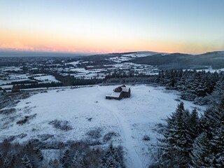 Aerial view of a picturesque winter landscape, featuring the Hellfire Club in Dublin