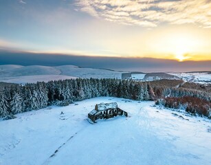 Aerial view of a picturesque winter landscape, featuring the Hellfire Club in Dublin