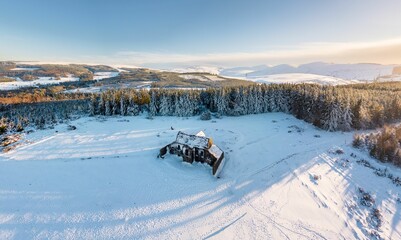 Aerial view of a picturesque winter landscape, featuring the Hellfire Club in Dublin