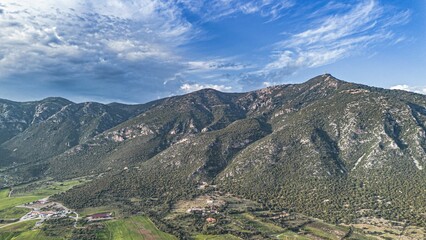 Fototapeta premium Aerial view of a scenic mountain range and valley in bright daylight