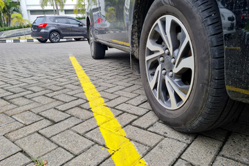 yellow lines on the parking floor. parking lines to facilitate car parking boundaries.