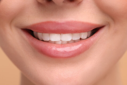 Woman with beautiful lips smiling, closeup view