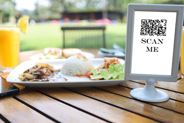 order online, table number board with bar code or QR code that says scan me to order. digital menu book and paperless concept.