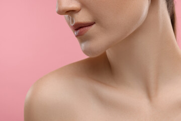 Obraz na płótnie Canvas Beauty concept. Woman on pink background, closeup