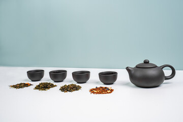 Green Tea Composition with bamboo leaves, banner. Chinese traditional tea set, tea ceremony concept, top view, copy space.