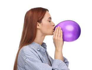 Woman inflating purple balloon on white background