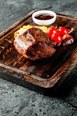 Grilled beef steak filet mignon with vegetables in plate