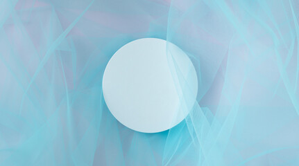 White round podium pedestal cosmetic beauty product presentation empty mockup on blue tulle