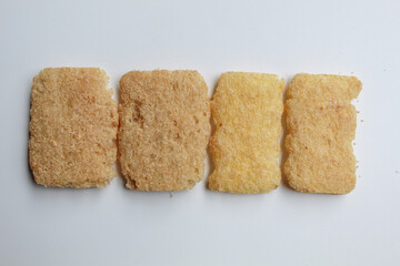 Rice crackers with powder flavoring, flat lay or top view, isolated on white background