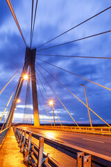 Cable-stayed bridge at sunset against a beautiful sky and in the rays of evening lighting. Murom....