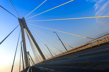 Cable-stayed bridge in the light of the morning sun and against the background of a clear blue sky. Murom. Russia.