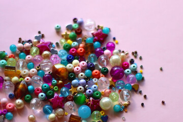 Various pink accessories and make up products on bright pink background. Selective focus.