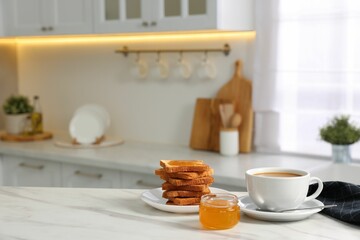 Breakfast served in kitchen. Fresh toasts, coffee and honey on white marble table. Space for text