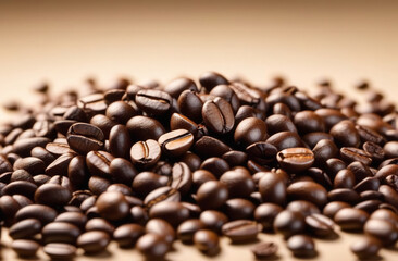 coffee beans scattered on a light beige background, close-up, with space for text
