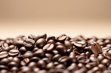 coffee beans scattered on a light beige background, close-up, with space for text