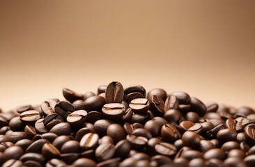 coffee beans scattered on a light beige background, close-up, with space for text