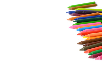 Crayons lined up isolated on white background.